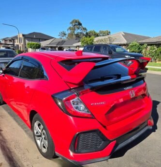 Honda Civic 10th Gen hatchback Type R spoiler installed Civic FK7 rear wing 2 tone red black Honda Civic hatchback rear spoiler blue black installed Type R style spoiler Civic rear view