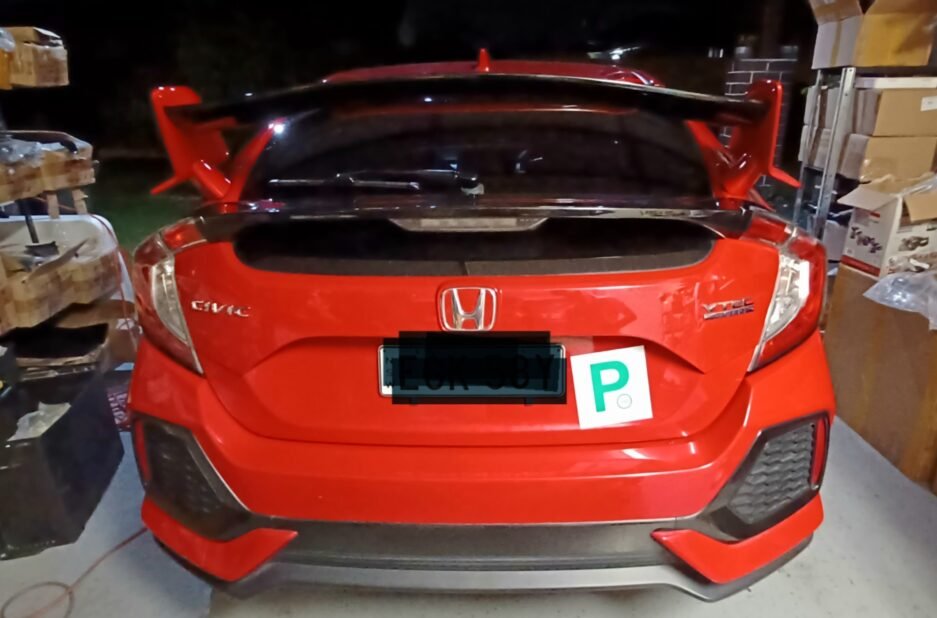 Honda Civic FK7 RS Hatchback red and gloss black Type R style spoiler installed rear view