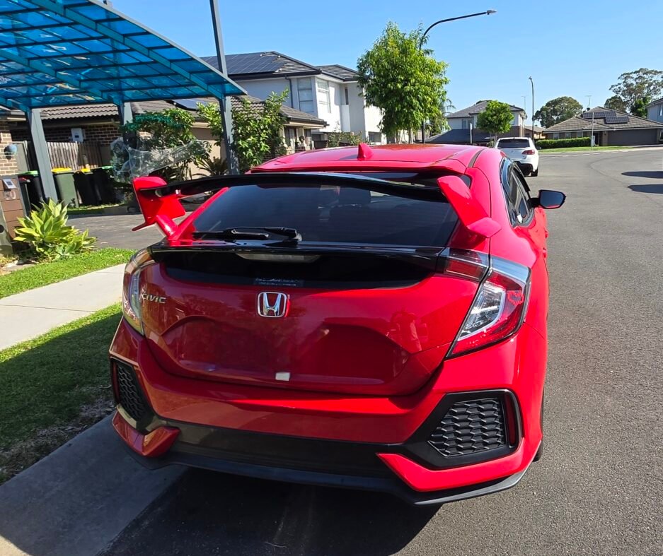 Honda Civic FK7 RS Hatchback red and gloss black Type R style spoiler installed rear view