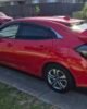 Honda Civic FK7 RS Hatchback red and gloss black Type R style spoiler installed Side view