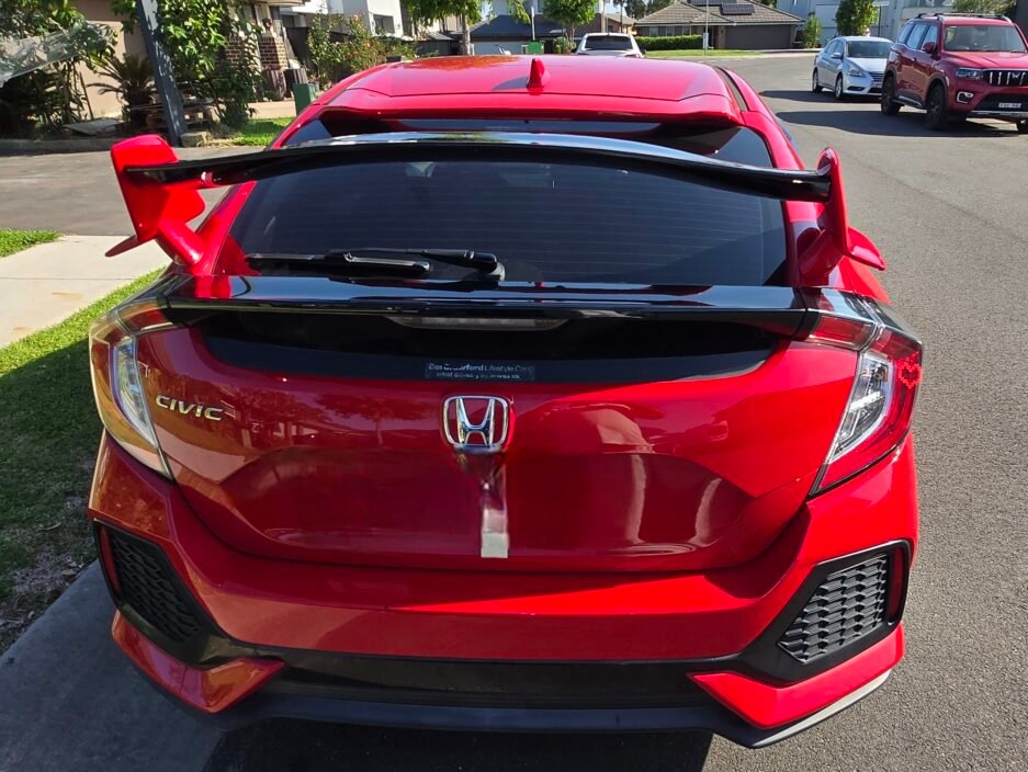 Honda Civic FK7 RS Hatchback red and gloss black Type R style spoiler installed rear view