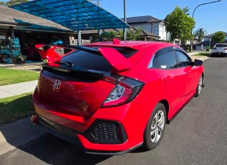 Honda Civic FK7 RS Hatchback red and gloss black Type R style spoiler installed side view